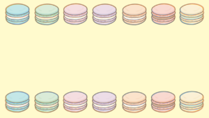 マカロンが並んだ黄色の背景画像